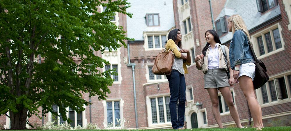 Students chatting outside res hall 